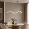 Led люстра з прозорими рельєфними кульками у латунному хвилеподібному корпусі 105 см 77093/11